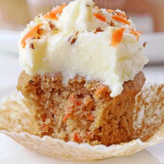 Moist carrot cupcakes with coconut pineapple cream cheese frosting, bakery-style, ready to serve