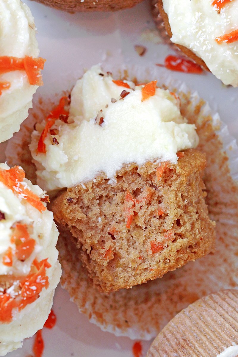 Moist carrot cupcakes with coconut pineapple cream cheese frosting, bakery-style, ready to serve