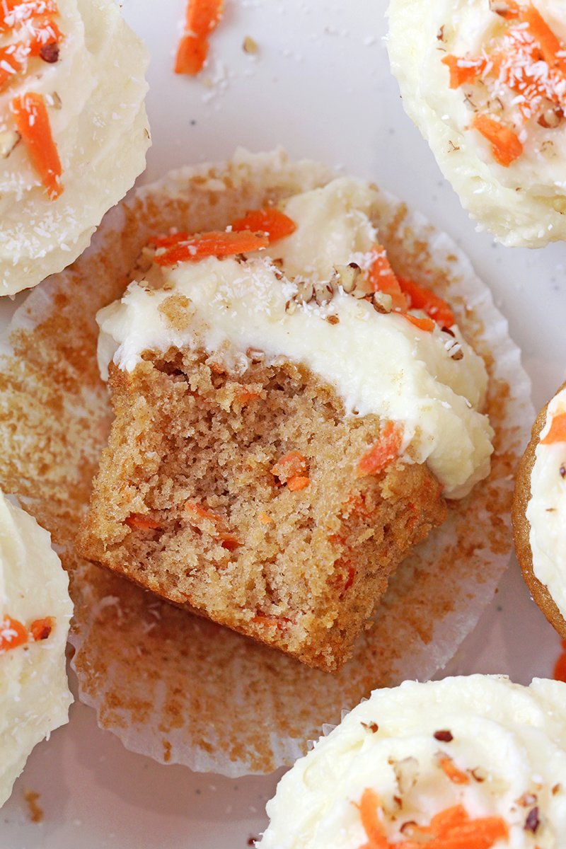 Moist carrot cupcakes with coconut pineapple cream cheese frosting, bakery-style, ready to serve