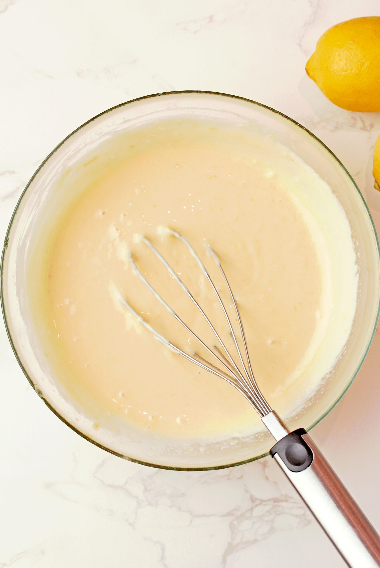 Step 3 - Make the creamy lemon filling
Whisk together sweetened condensed milk, egg yolk, fresh lemon juice, and lemon zest until smooth and creamy.