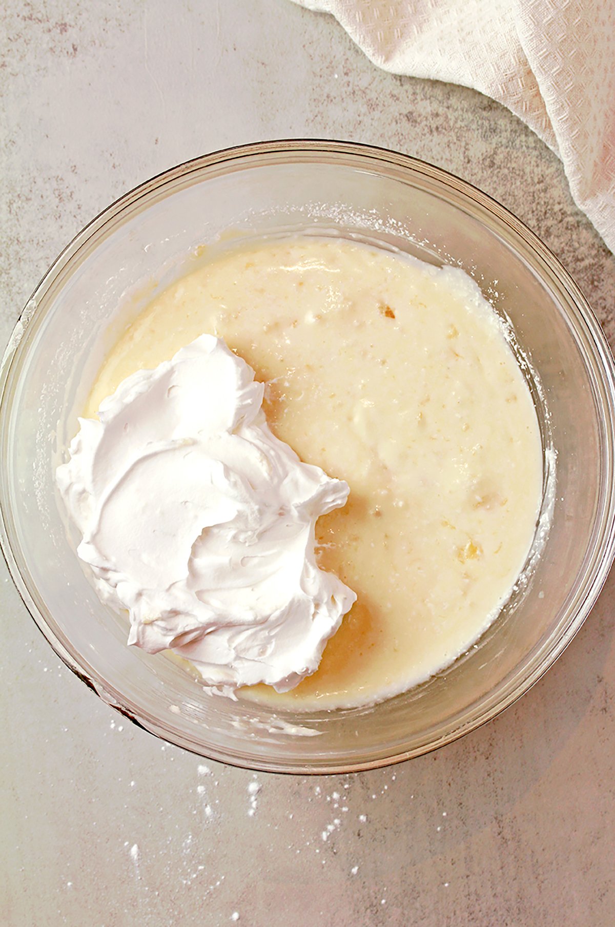 Fluffy coconut pineapple cream cheese frosting ready to use.