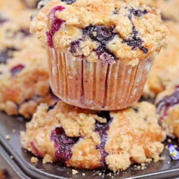 Made with ripe mashed bananas, juicy blueberries, crunchy walnuts, and topped with a buttery cinnamon streusel, Banana Blueberry Muffins with Crumb Topping