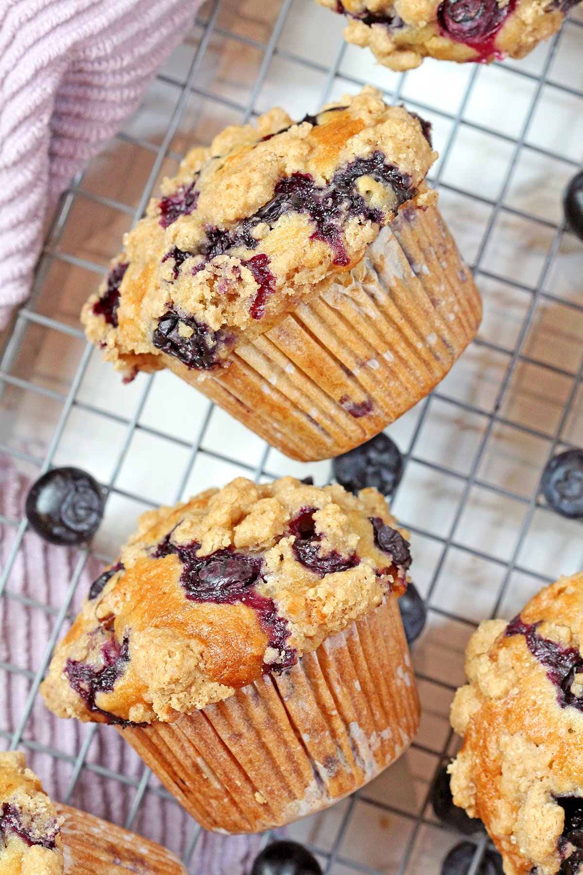 Homemade banana blueberry muffins with cinnamon crumb topping and fresh blueberries