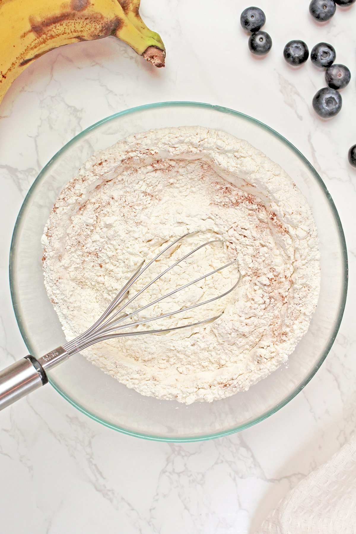 Step 2. Mix the Dry Ingredients
In a medium bowl, whisk together flour, baking powder, cinnamon, and salt.
