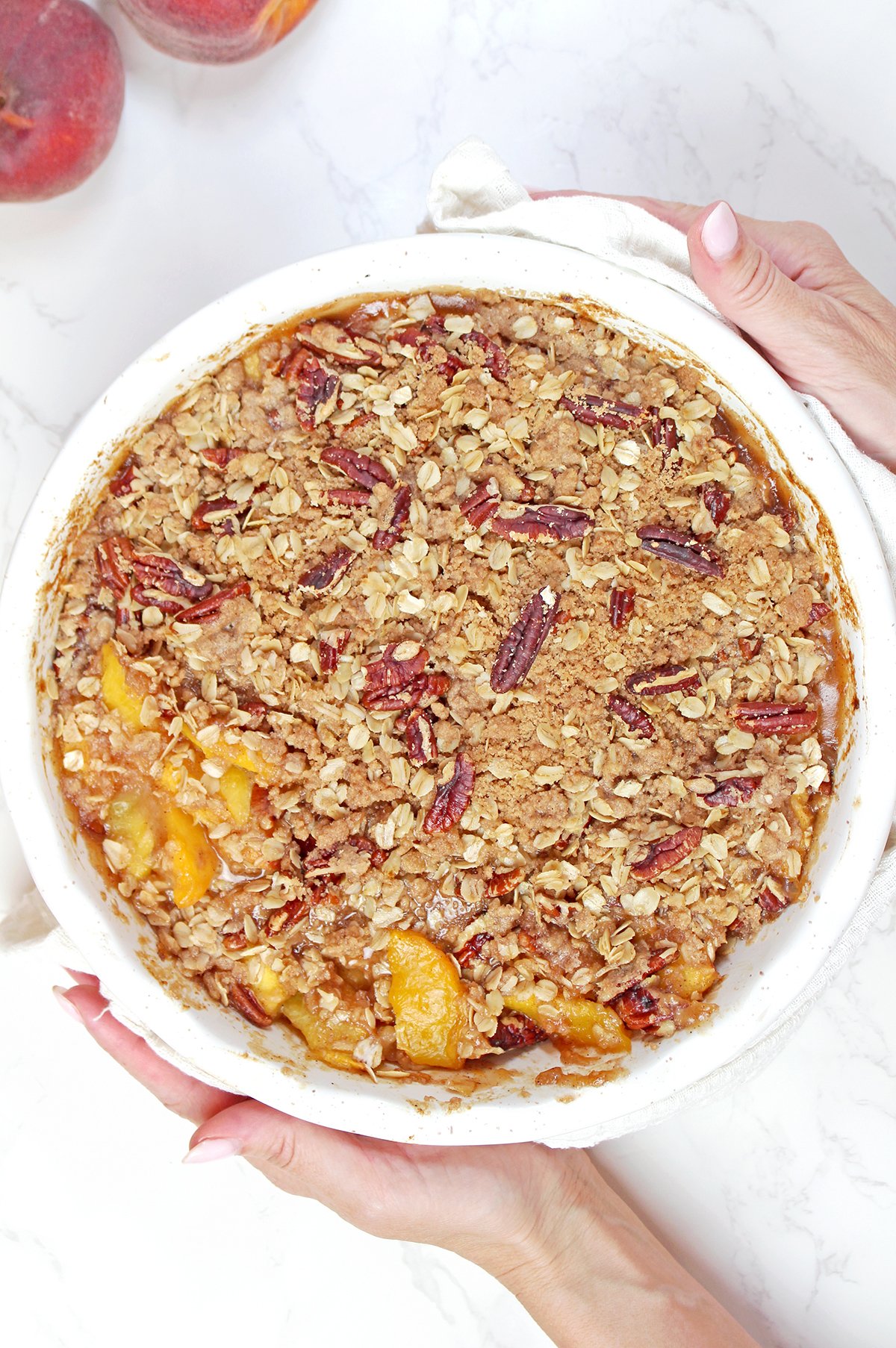 Step 4 - Bake the Peach Crisp
Baking in the oven until the topping is golden brown and the peach filling is bubbling around the edges.