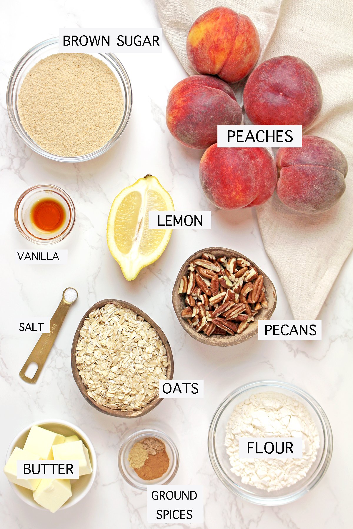 Ingredients including fresh peaches, oats, butter, brown sugar, cinnamon, ginger, and nutmeg.