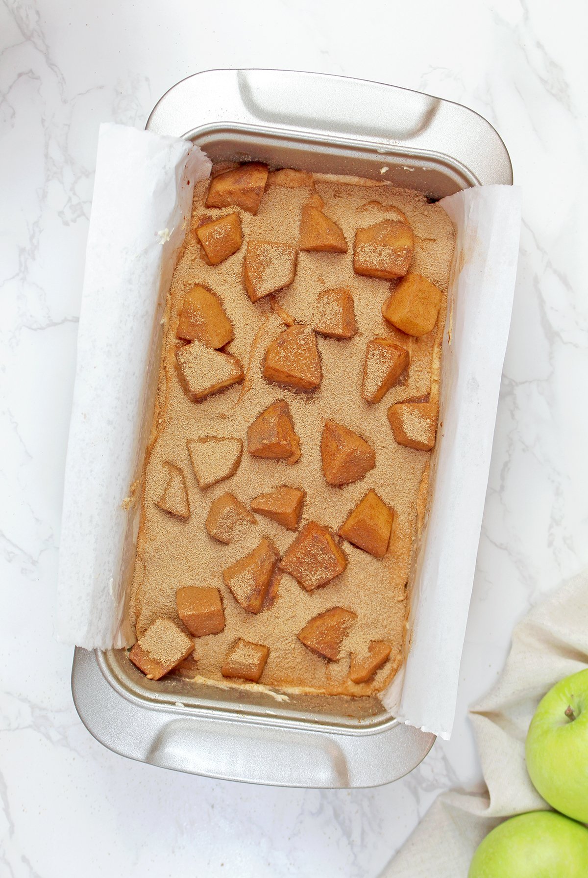Step 4 - Batter layered with diced apples and cinnamon sugar.