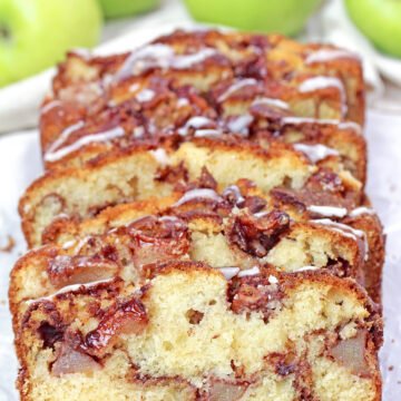 Sliced apple cinnamon bread with tender apple pieces and cinnamon sugar layers.