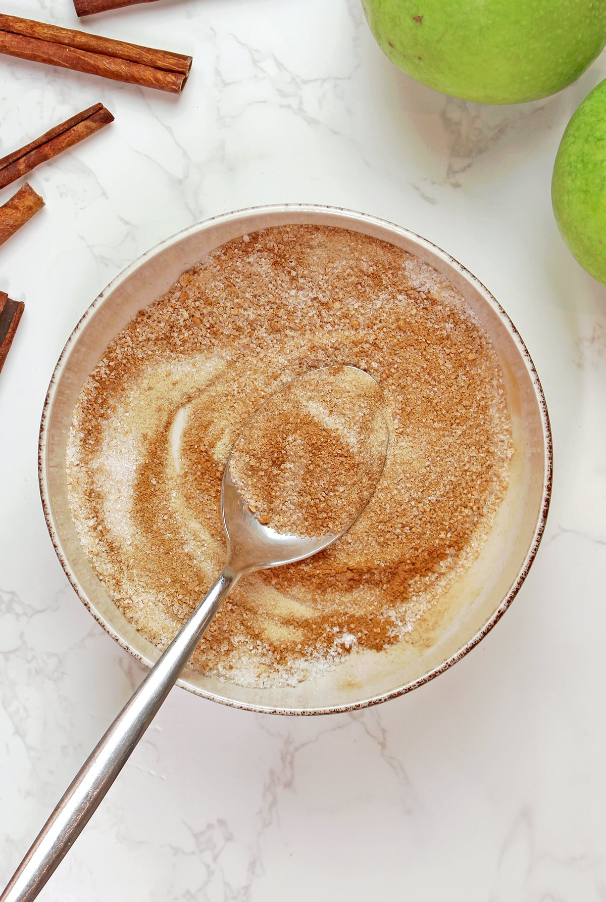 Cinnamon sugar mixture prepared for an easy puff pastry apple tart.