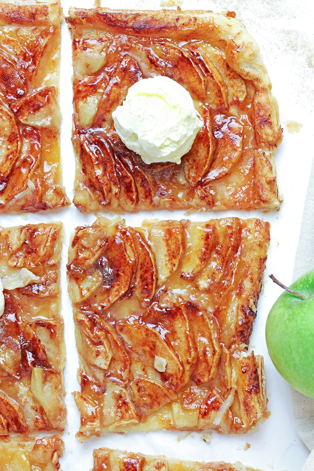 Easy Puff Pastry Apple Tart with cinnamon apples and apricot jam on flaky pastry.