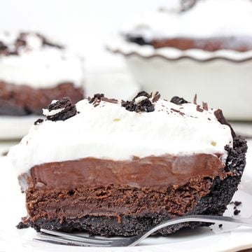 Mississippi Mud Pie with Oreo crust, brownie layer, chocolate pudding, and whipped cream.