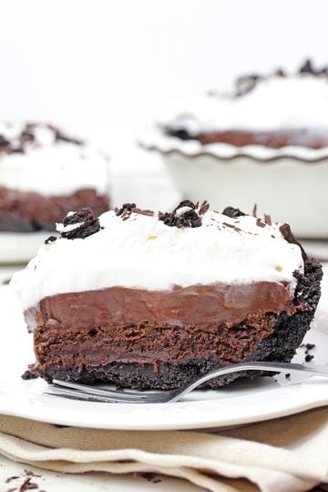 Mississippi Mud Pie with Oreo crust, brownie layer, chocolate pudding, and whipped cream.