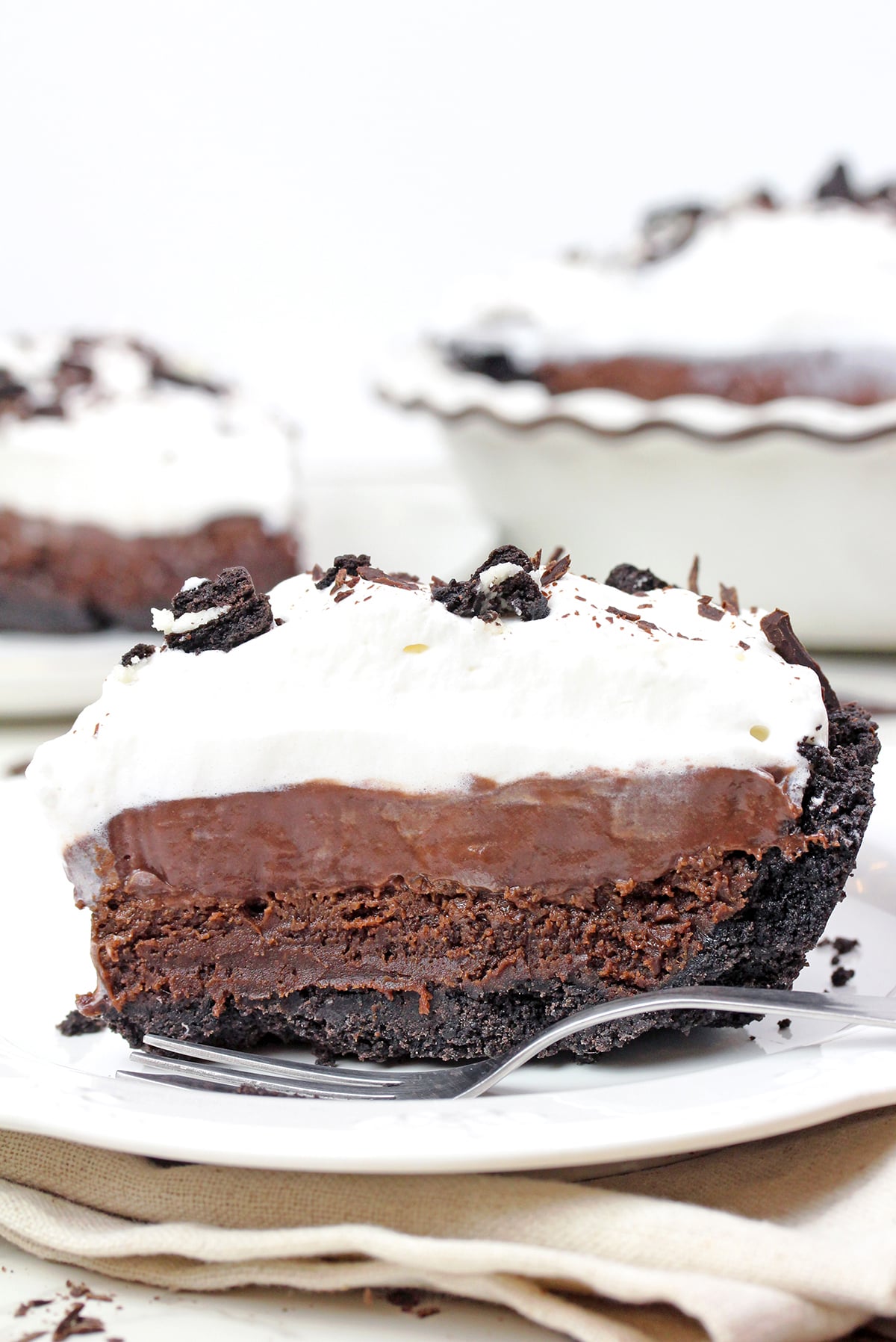 Mississippi Mud Pie with Oreo crust, brownie layer, chocolate pudding, and whipped cream.