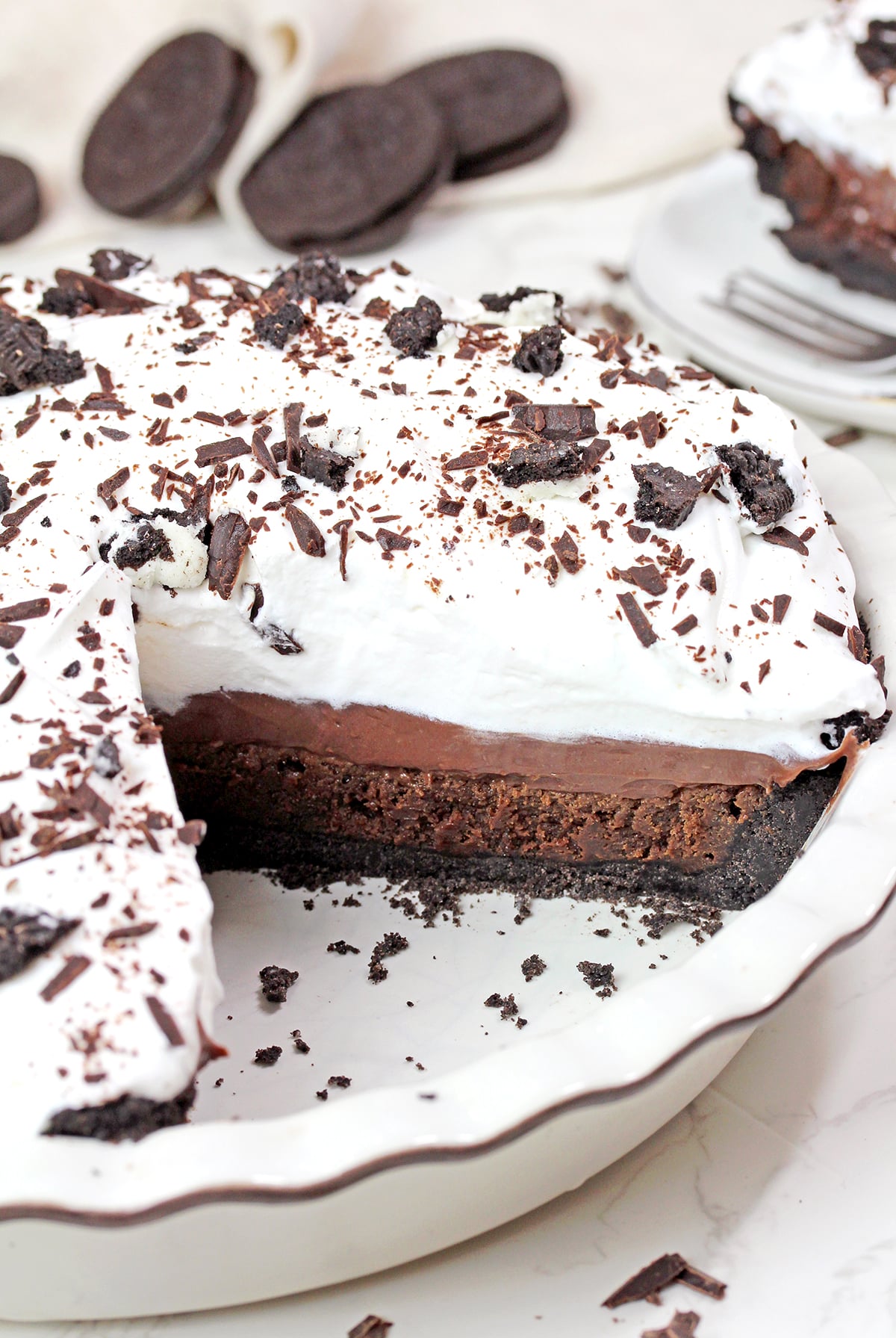 Mississippi Mud Pie with Oreo crust, brownie layer, chocolate pudding, and whipped cream.