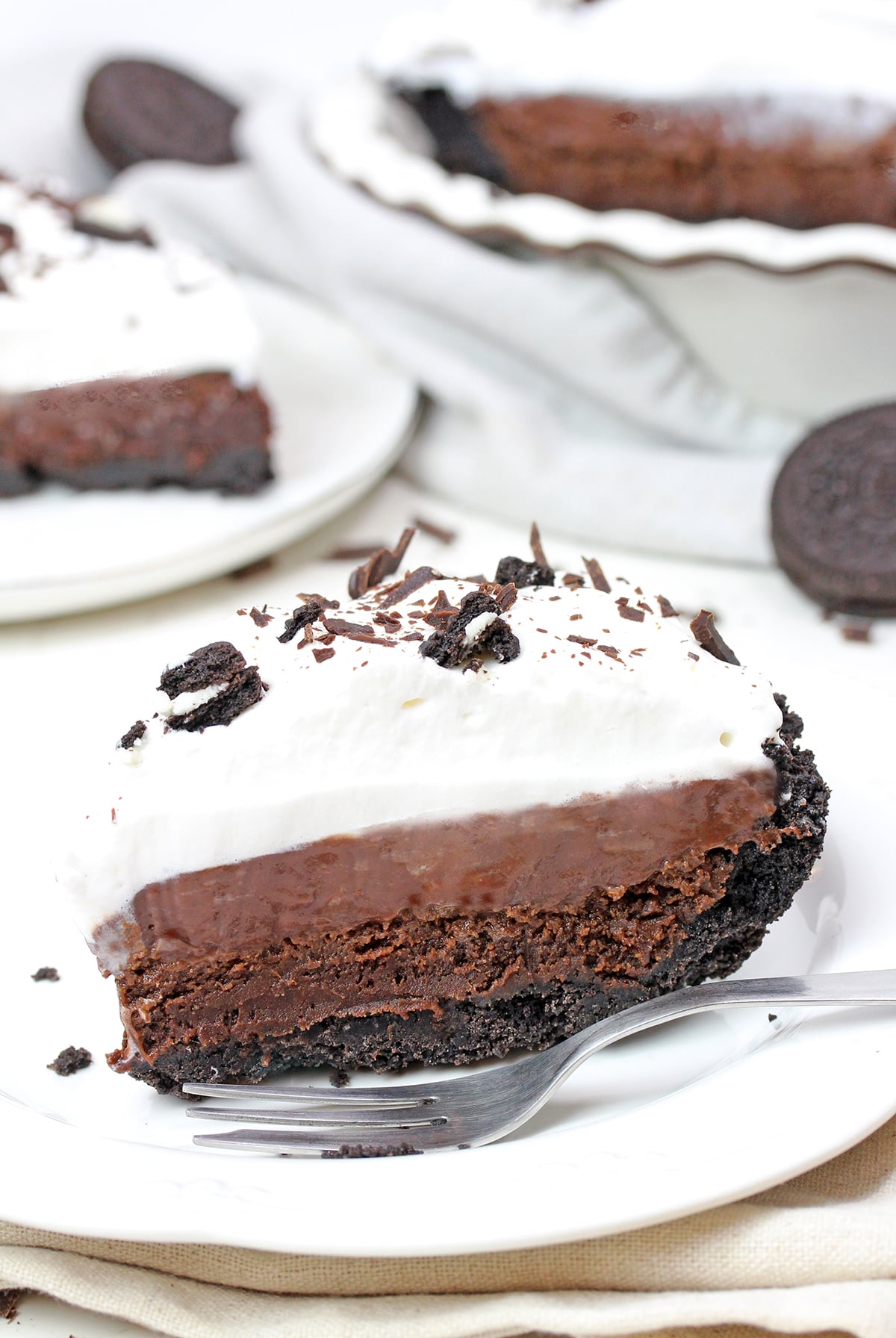 Mississippi Mud Pie with Oreo crust, brownie layer, chocolate pudding, and whipped cream.