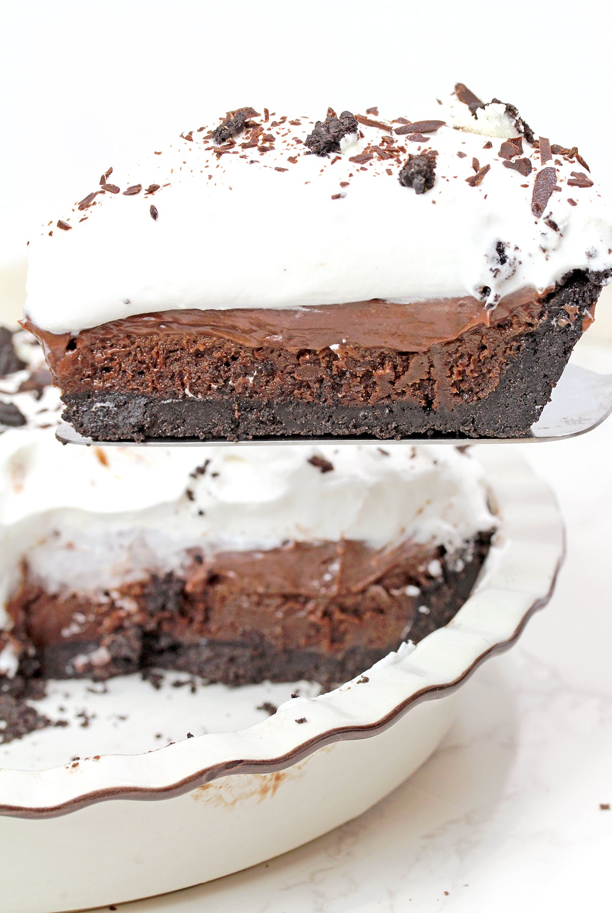 Mississippi Mud Pie with Oreo crust, brownie layer, chocolate pudding, and whipped cream.