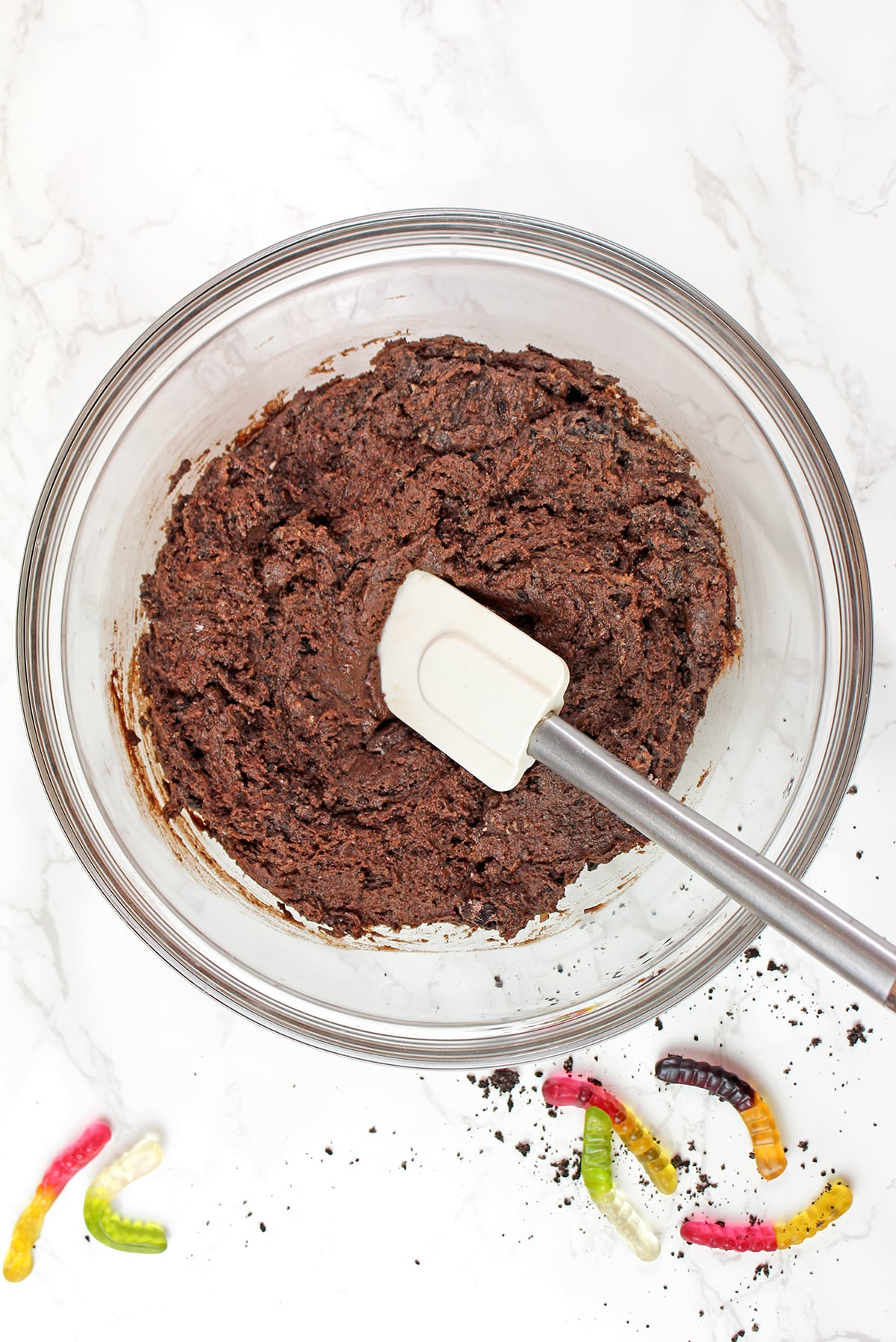 Cookie dough mixed with Oreo crumbs in a bowl.