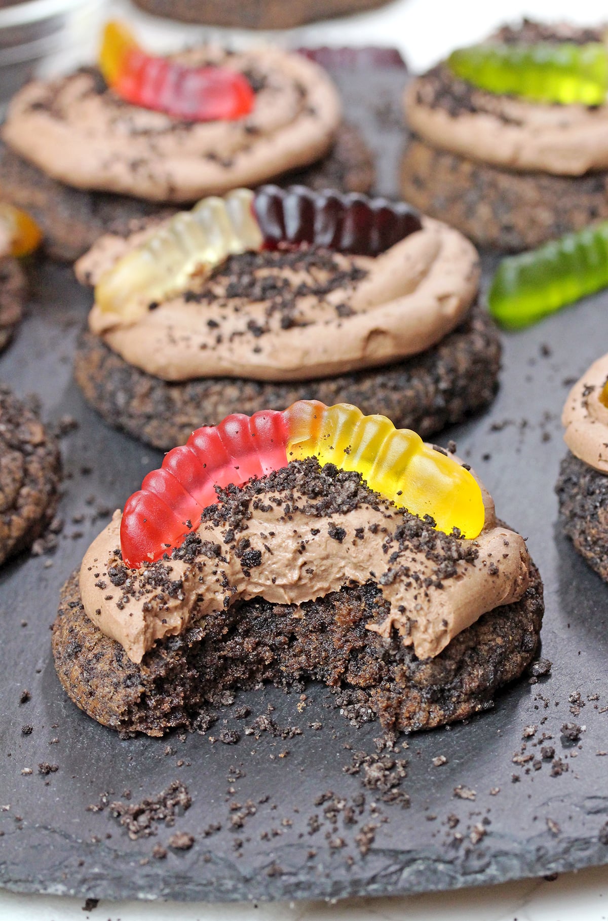 Dirt Cake Cookie with a bite showing its soft, chewy texture.