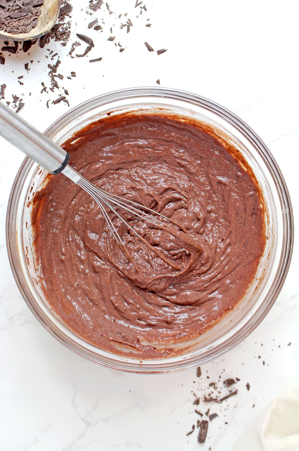 Whisking instant chocolate pudding mix with cold milk until smooth and thick for Mississippi Mud Pie.